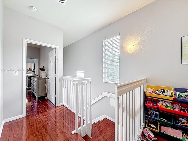 294 Las Brisas Cir, Sunrise, FL 33326 - corridor with an upstairs landing, wood finished floors, and baseboards