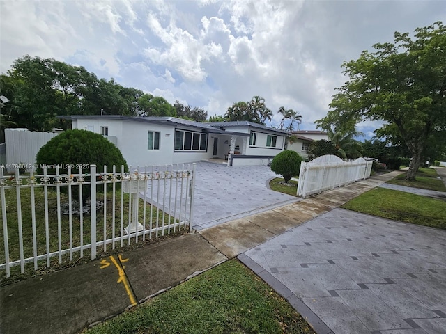 12585 NE Miami Ct, North Miami, FL 33161 - view of front of home with a fenced front yard