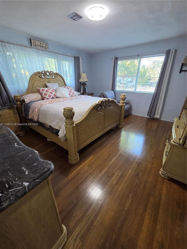 12585 NE Miami Ct, North Miami, FL 33161 - bedroom featuring visible vents and dark wood-style floors