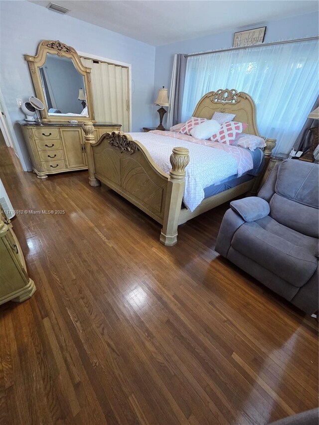 12585 NE Miami Ct, North Miami, FL 33161 - bedroom featuring visible vents and dark wood-style floors