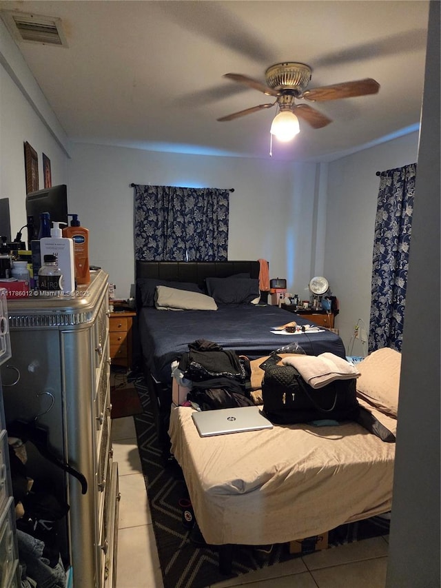 12585 NE Miami Ct, North Miami, FL 33161 - bedroom with light tile patterned flooring, ceiling fan, and visible vents