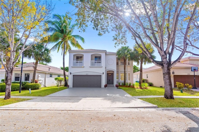 view of front of property featuring an attached garage, driveway, a balcony, and a front lawn