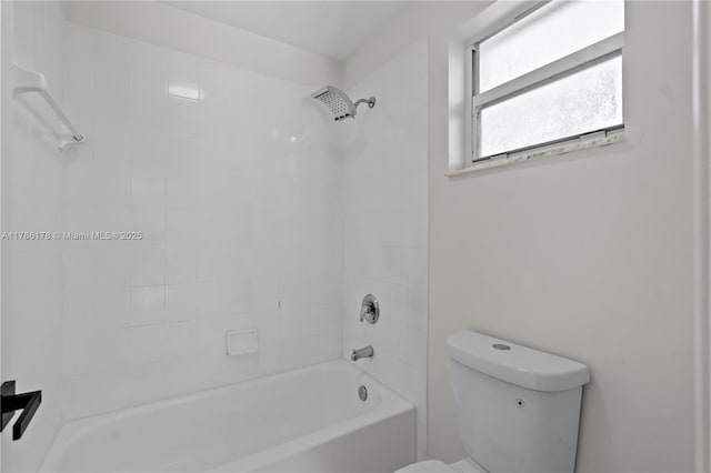 bathroom with toilet and tub / shower combination
