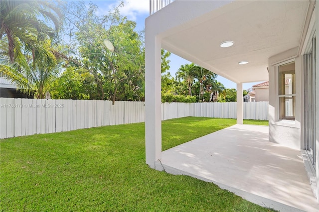 view of yard with a patio and a fenced backyard