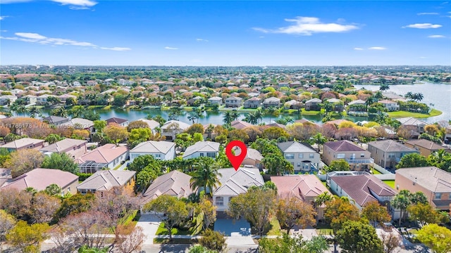 bird's eye view featuring a water view and a residential view