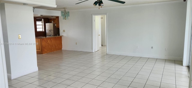 14195 SW 87th St Unit B306, Miami, FL 33183 - empty room with ceiling fan, a textured ceiling, light tile patterned floors, crown molding, and baseboards