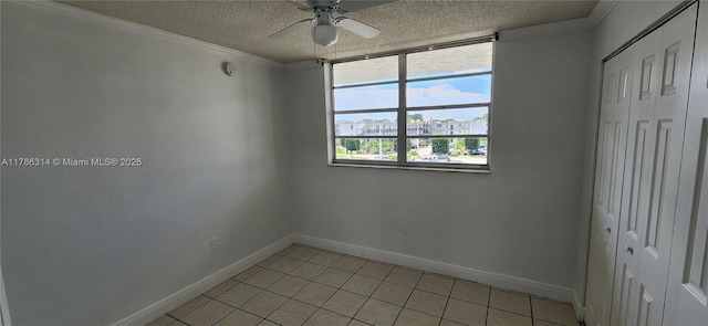 14195 SW 87th St Unit B306, Miami, FL 33183 - unfurnished bedroom featuring a textured ceiling, light tile patterned floors, baseboards, a closet, and a ceiling fan