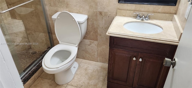 14195 SW 87th St Unit B306, Miami, FL 33183 - bathroom with toilet, vanity, a shower stall, and tile walls