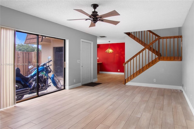 2572 Lakeview Ct, Cooper City, FL 33026 - interior space with visible vents, stairs, wood finished floors, baseboards, and ceiling fan