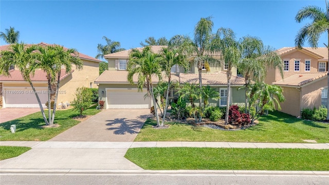 1454 Newhaven Point Ln, West Palm Beach, FL 33411 - view of front of home featuring a tiled roof, driveway, stucco siding, a front yard, and an attached garage