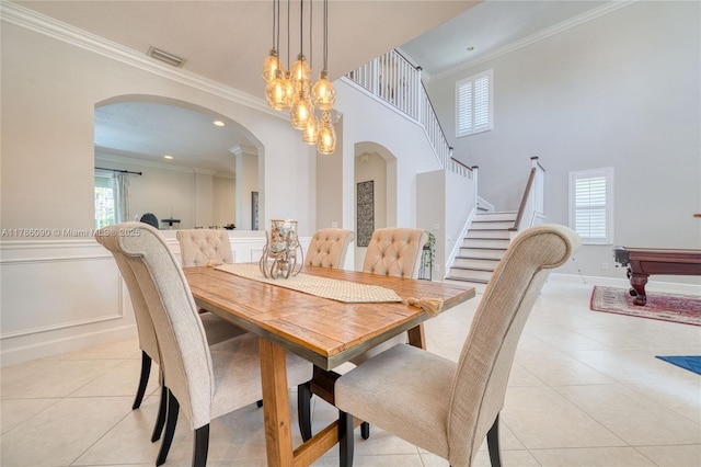 1454 Newhaven Point Ln, West Palm Beach, FL 33411 - dining space with arched walkways, light tile patterned floors, ornamental molding, stairs, and pool table