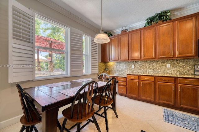 1454 Newhaven Point Ln, West Palm Beach, FL 33411 - dining area featuring light tile patterned flooring, healthy amount of natural light, ornamental molding, and a textured ceiling