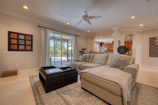 1454 Newhaven Point Ln, West Palm Beach, FL 33411 - living area featuring a ceiling fan, crown molding, arched walkways, recessed lighting, and light tile patterned floors