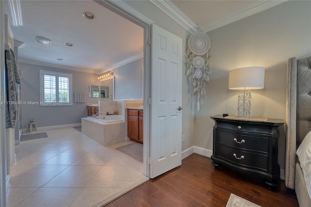 1454 Newhaven Point Ln, West Palm Beach, FL 33411 - bathroom featuring ornamental molding, a garden tub, vanity, and wood finished floors