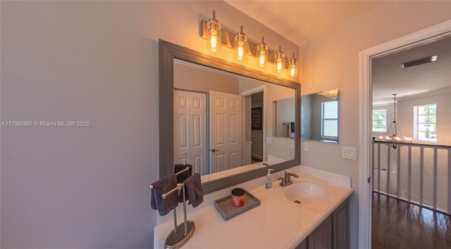 1454 Newhaven Point Ln, West Palm Beach, FL 33411 - bathroom featuring vanity and a chandelier