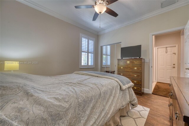 1454 Newhaven Point Ln, West Palm Beach, FL 33411 - bedroom featuring wood finished floors, crown molding, and a ceiling fan
