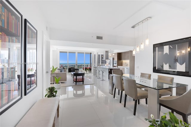 dining room with visible vents and light tile patterned floors