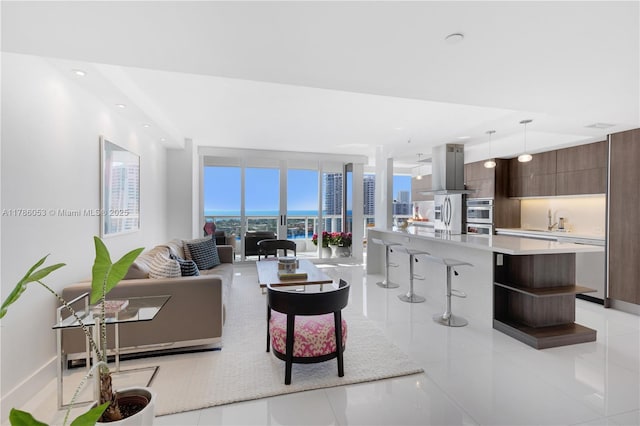 living room with recessed lighting and light tile patterned floors