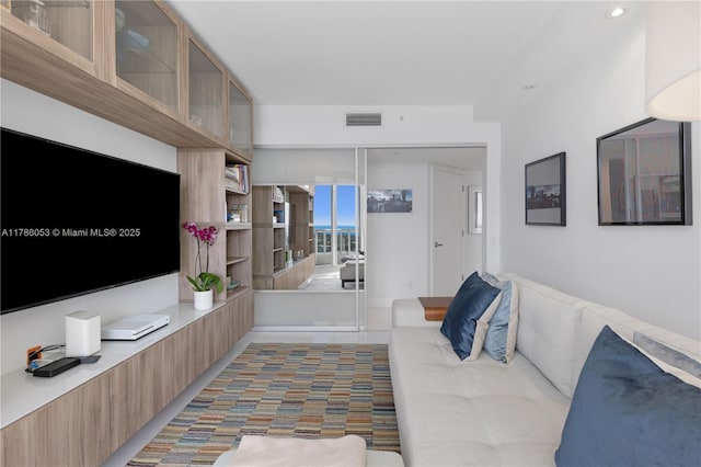 living room featuring visible vents and recessed lighting