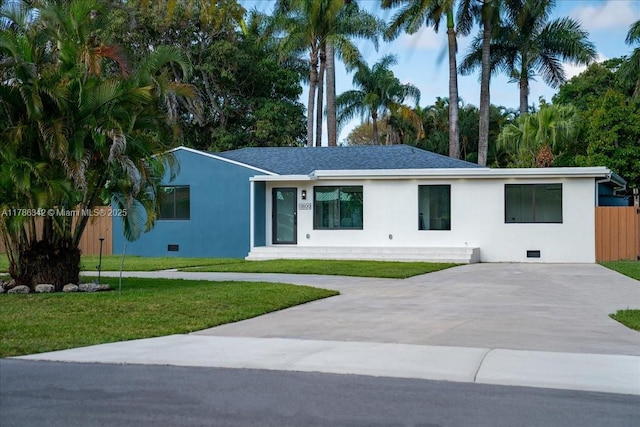 single story home with stucco siding, crawl space, a front yard, and concrete driveway
