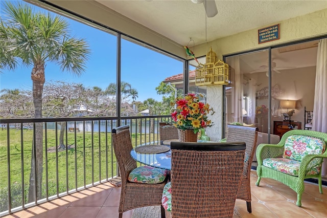 6121 SE Landing Way Unit 13, Stuart, FL 34997 - sunroom / solarium with ceiling fan and a water view