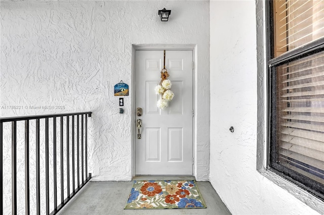 6121 SE Landing Way Unit 13, Stuart, FL 34997 - view of exterior entry featuring stucco siding
