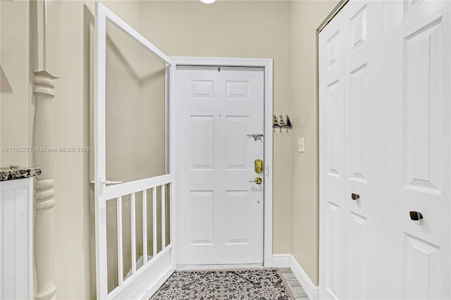 6121 SE Landing Way Unit 13, Stuart, FL 34997 - doorway to outside with baseboards