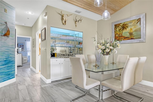 6121 SE Landing Way Unit 13, Stuart, FL 34997 - dining space with wooden ceiling, baseboards, bar area, and recessed lighting