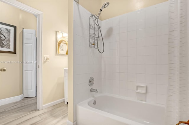 6121 SE Landing Way Unit 13, Stuart, FL 34997 - full bathroom with shower / bathtub combination with curtain, wood finished floors, and baseboards
