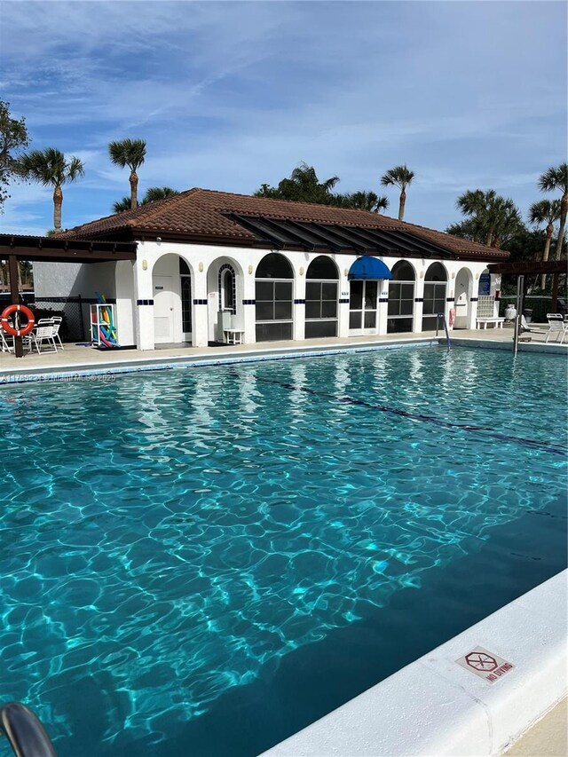 6121 SE Landing Way Unit 13, Stuart, FL 34997 - community pool featuring a patio area