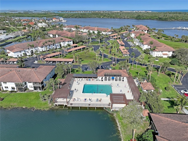 6121 SE Landing Way Unit 13, Stuart, FL 34997 - aerial view of property and surrounding area featuring a large body of water, nearby suburban area, and a pool
