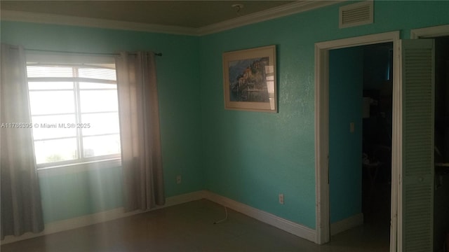 1950 Biarritz Dr Unit 1, Miami Beach, FL 33141 - spare room featuring crown molding and baseboards
