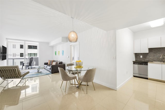6365 Collins Ave Unit 805, Miami Beach, FL 33141 - dining space featuring light tile patterned floors and baseboards
