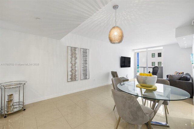 6365 Collins Ave Unit 805, Miami Beach, FL 33141 - tiled dining space with baseboards