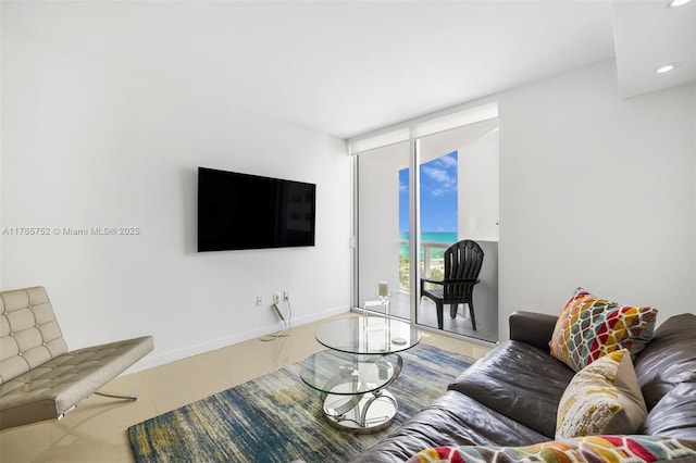 6365 Collins Ave Unit 805, Miami Beach, FL 33141 - living room featuring expansive windows, recessed lighting, and baseboards