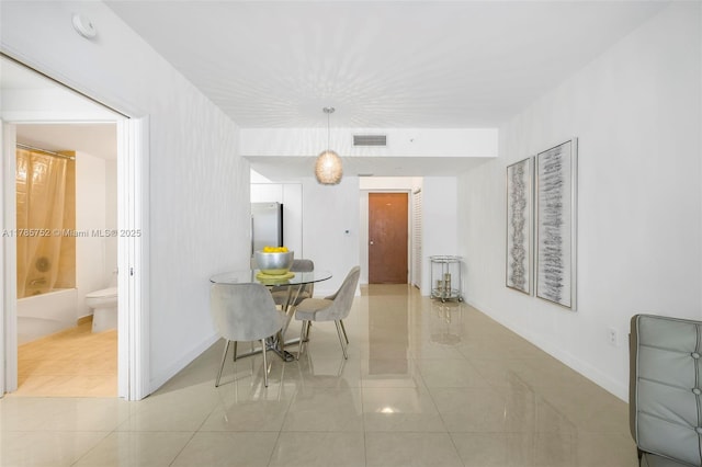 6365 Collins Ave Unit 805, Miami Beach, FL 33141 - dining room featuring baseboards, visible vents, and light tile patterned floors
