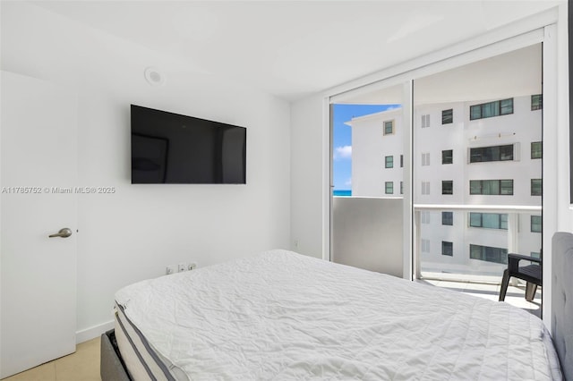 6365 Collins Ave Unit 805, Miami Beach, FL 33141 - bedroom featuring baseboards and tile patterned floors