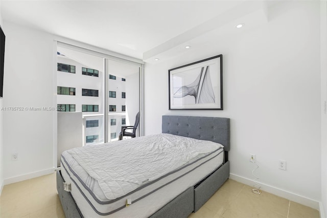 6365 Collins Ave Unit 805, Miami Beach, FL 33141 - bedroom with light tile patterned floors, recessed lighting, and baseboards