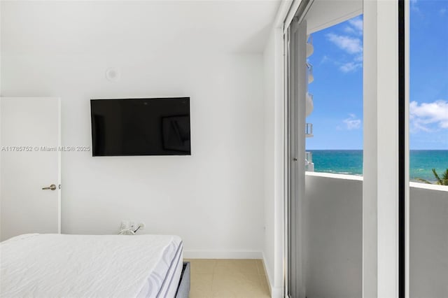 6365 Collins Ave Unit 805, Miami Beach, FL 33141 - bedroom featuring light tile patterned floors and baseboards