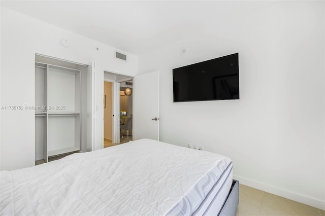 6365 Collins Ave Unit 805, Miami Beach, FL 33141 - bedroom with baseboards, visible vents, and a closet