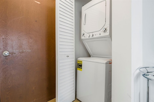6365 Collins Ave Unit 805, Miami Beach, FL 33141 - laundry room featuring stacked washer and clothes dryer and laundry area