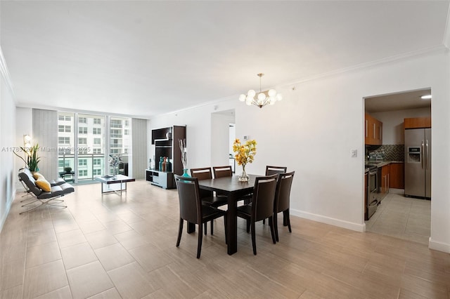 3001 S Ocean Dr Unit 1407, Hollywood, FL 33019 - dining space featuring crown molding, a wall of windows, and an inviting chandelier