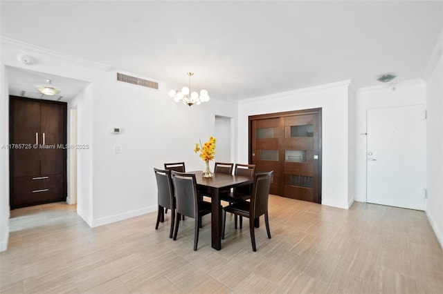 3001 S Ocean Dr Unit 1407, Hollywood, FL 33019 - dining area featuring ornamental molding, light wood-type flooring, baseboards, visible vents, and a notable chandelier