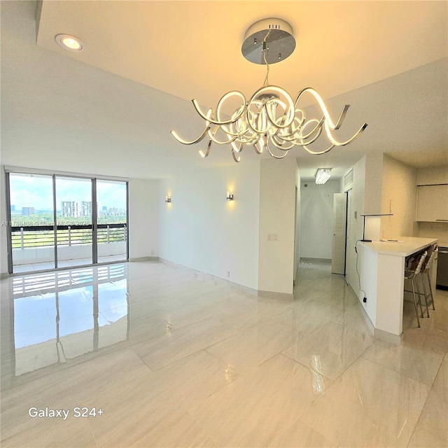 3400 192nd St Unit 1606, Aventura, FL 33180 - empty room with a chandelier and a wall of windows