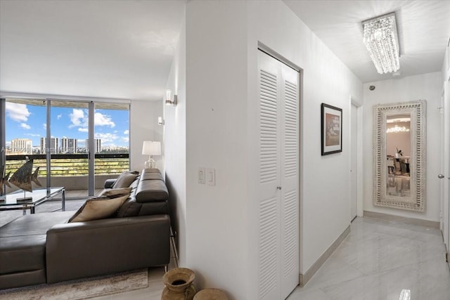 3400 192nd St Unit 1606, Aventura, FL 33180 - hallway featuring baseboards and a chandelier