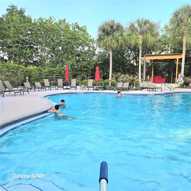 3400 192nd St Unit 1606, Aventura, FL 33180 - community pool featuring a gazebo, a patio area, and view of scattered trees