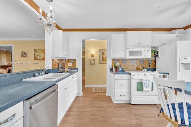 14898 Wildflower Ln Unit 0, Delray Beach, FL 33446 - kitchen featuring white appliances, a sink, ornamental molding, white cabinets, and tasteful backsplash