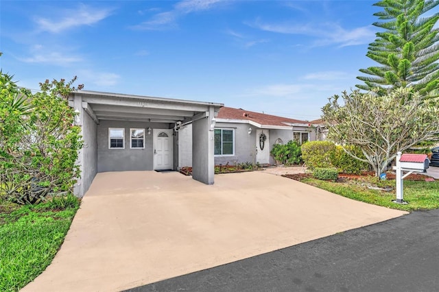 14898 Wildflower Ln Unit 0, Delray Beach, FL 33446 - ranch-style home with stucco siding and a carport