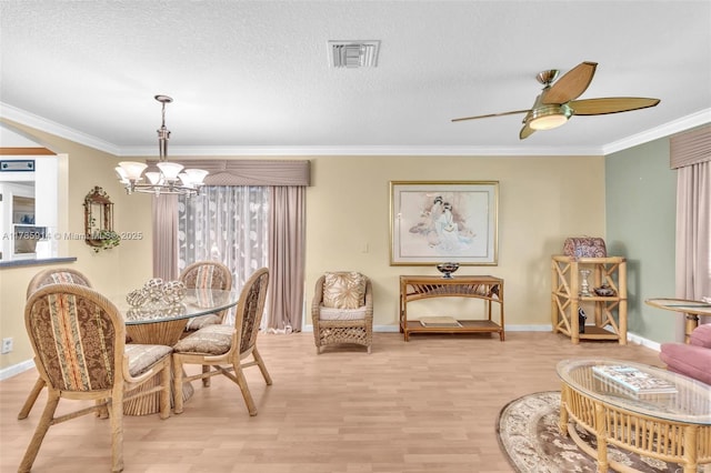 14898 Wildflower Ln Unit 0, Delray Beach, FL 33446 - dining room with a chandelier, light wood finished floors, baseboards, crown molding, and ceiling fan