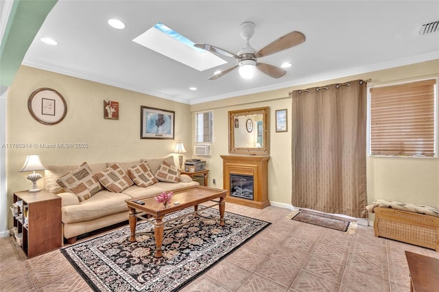14898 Wildflower Ln Unit 0, Delray Beach, FL 33446 - living room with ceiling fan, crown molding, a glass covered fireplace, a skylight, and recessed lighting